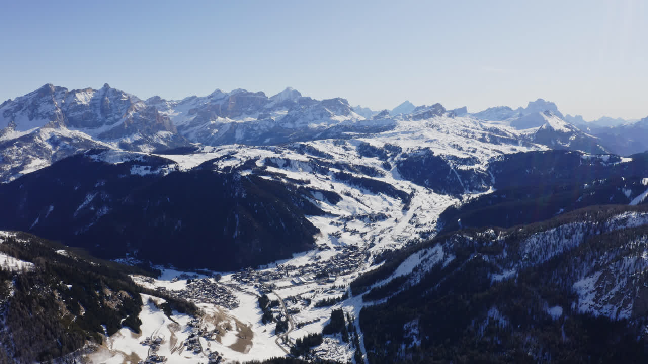 Aerial Panorama Of Snow-Covered Ski Resort In Dolomites Mountains In Italy
