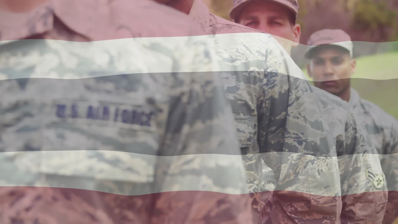 Front soldier sliding rifle into port-arms after camera zoom, demonstrating defense drill focus