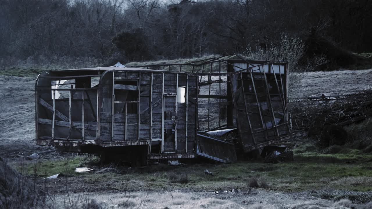 A Broken Wooden Horse Carriage On A Grassfield  In Northern Ireland -wide shot