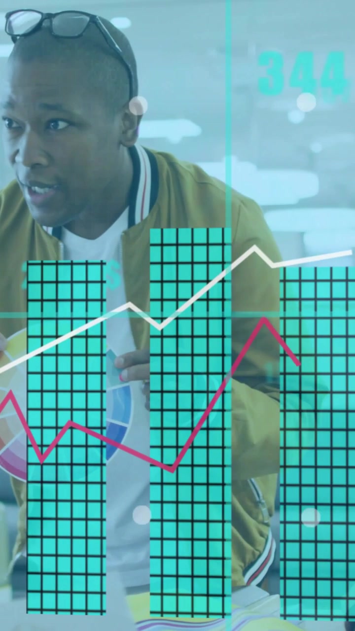 Vertical video: Designer holding colorwheel pointing in office initiating expanding HUD for design