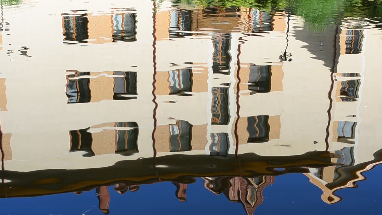 Reflection of the building in water. Reflection shooting