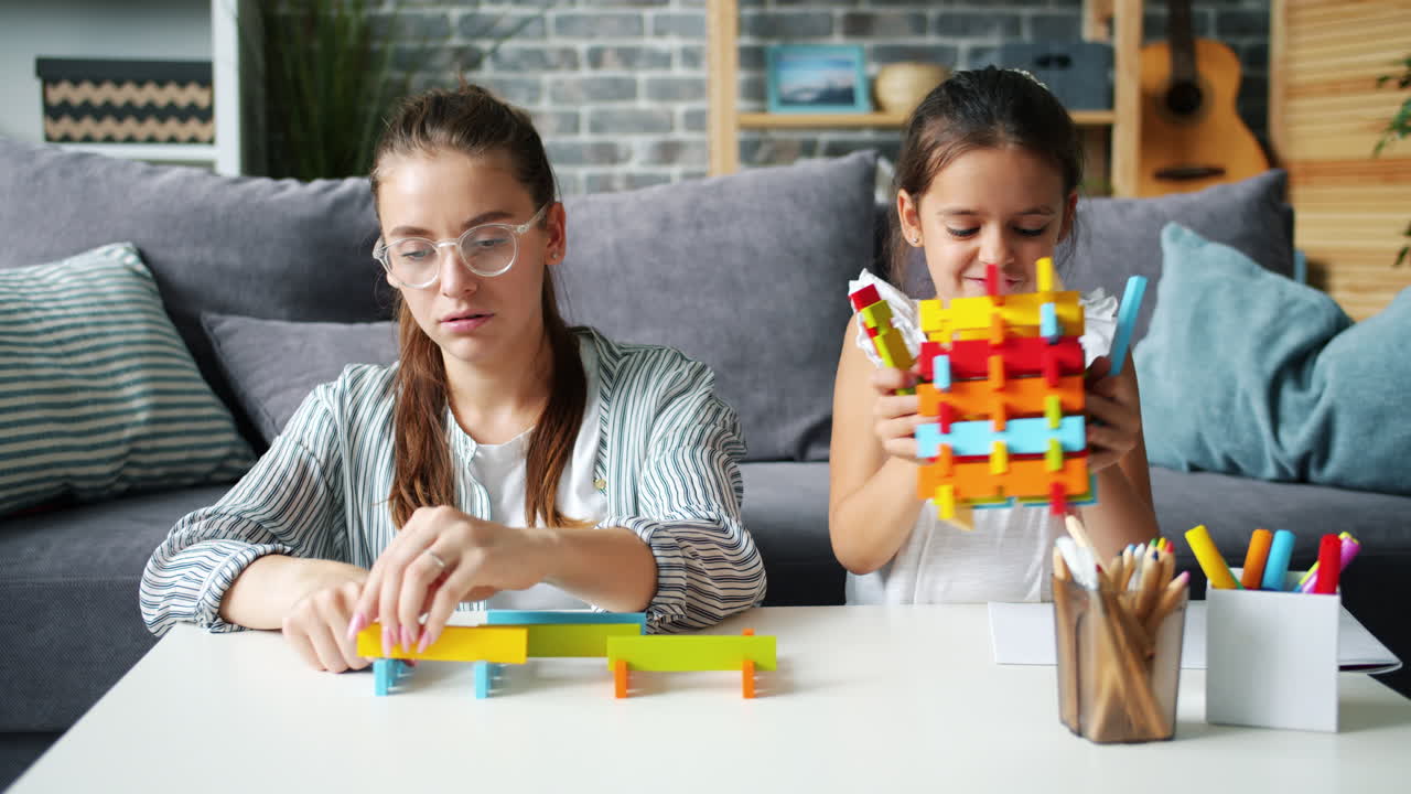 Mother and Daughter Playing with Wooden Blocks