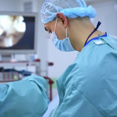 doctors working with surgical instruments