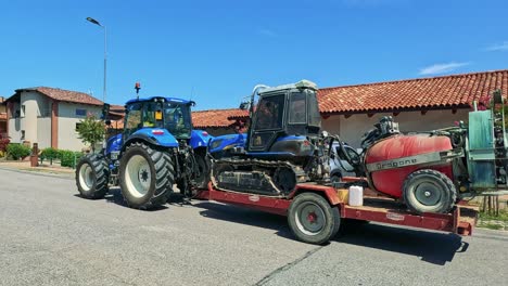 a tractor drives down a residential street