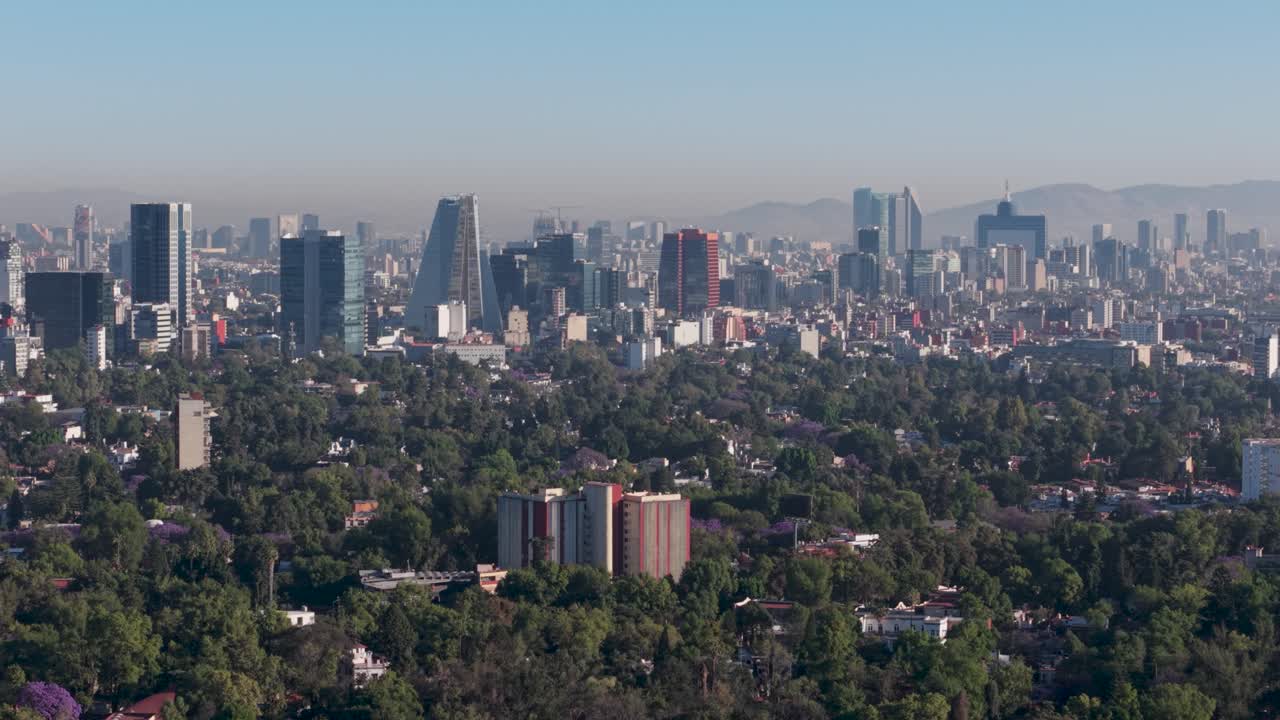 Parallax drone view of Mexico City on a sunny day
