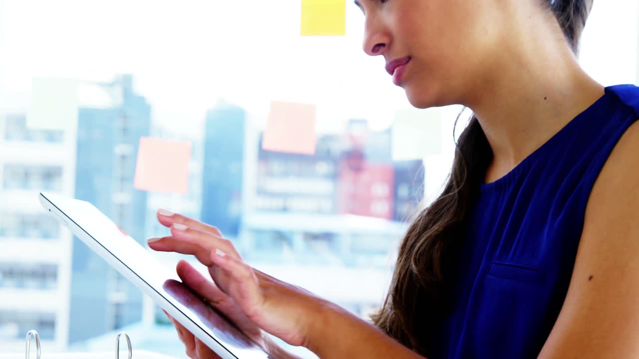 Woman using smart device in office