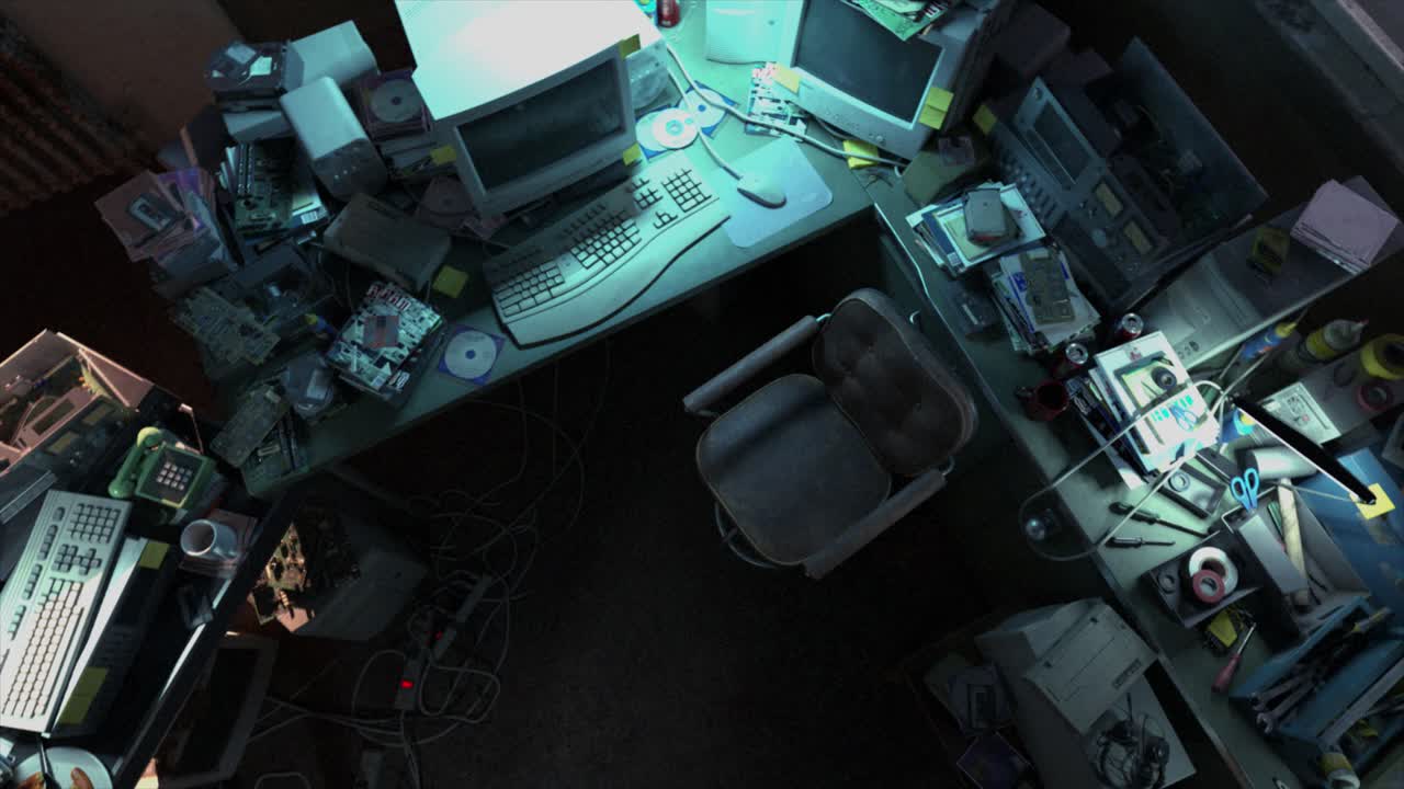 A cluttered old seedy office workstation at night, with retro 1990s period computer equipment and assorted electronics gear stripped down for repair - high rotating bird's eye view