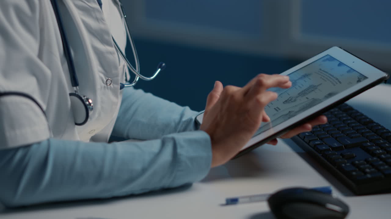 Doctor using tablet with medical data