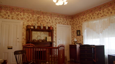 old colonial baby room with crib and fan