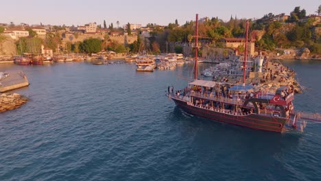 sunset tour boat in a mediterranean harbor