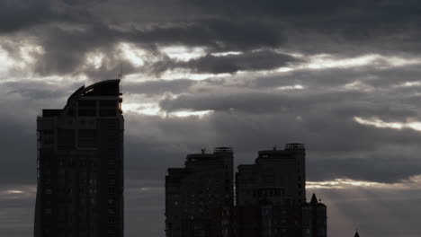 high-rise buildings in sleeping area drone shot. dark city panel construction.