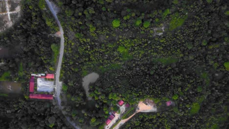 Amazing-cinematic-4K-residential-drone-footage-after-deforestation-issue-consists-of-many-homes,-road,-trees,-lake-and-infrastructure-in-the-middle-of-tropical-forest-located-in-Riau,-Indonesia