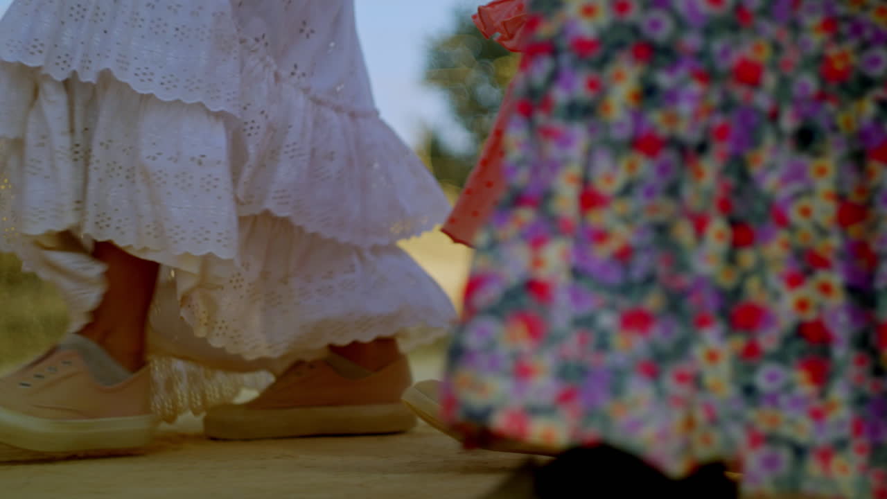 A woman’s silhouette bathed in warm sunrise light, symbolizing faith and quiet devotion on the Rocío route