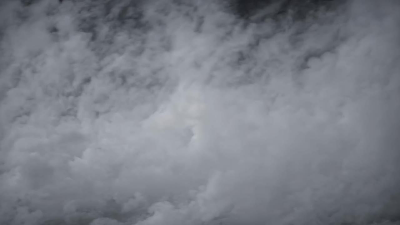 Aerial video capturing dense, swirling clouds from above, showcasing a dramatic and ethereal