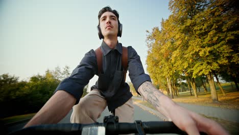 man riding bike in park