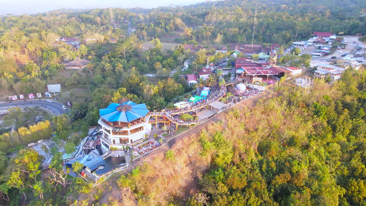 Aerial view of "HEHA SKY VIEW" tourist attraction in the evening at sunset, Yogyakarta, Indonesia - 4K drone shot