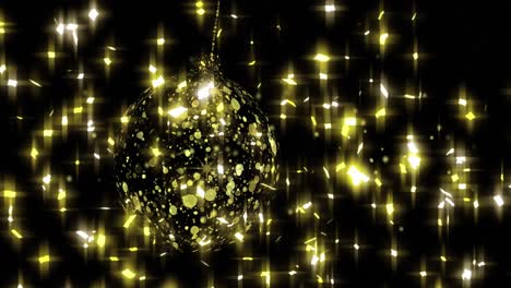 Animation-of-stars-falling-over-golden-bauble-on-black-background