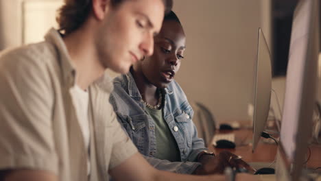 students collaborating on computer