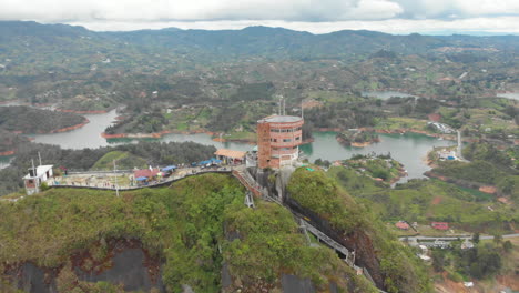 View-from-the-top-of-the-Peñol-Stone-in-Guatape,-Antioquia---Tourist-site-of-Colombia---aerial-drone-shot