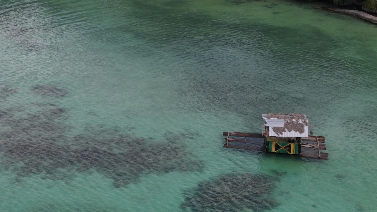 Drone View Of Bamboo Raft With Hut Floating In The Ocean In Ocho Rios
