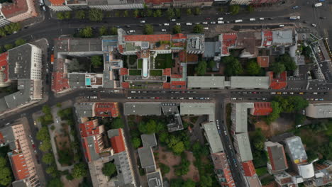 Aerial-birds-eye-overhead-top-down-view-of-streets-in-urban-neighbourhood.-Street-with-car-traffic-and-parallel-cycle-path-in-next-street.-Berlin,-Germany.