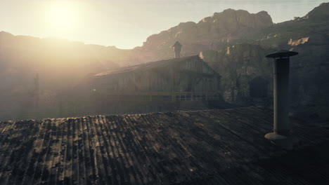 abandoned cabin in a misty mountain valley