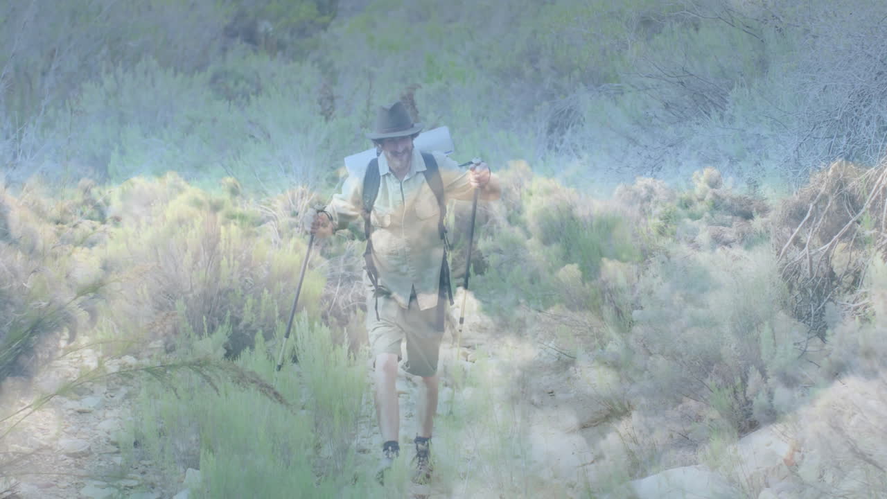 Male hiker walking on desert trail, presenting travel chart with elevation and waypoint icons
