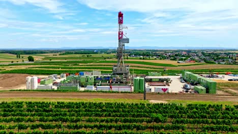 aerial towards oil drilling rig on the fields in austria