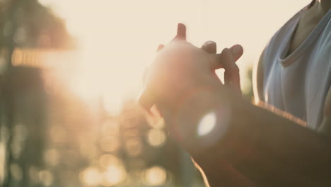 Close-Up-Of-A-Sportsman-Stretching-Wrists-And-Hands