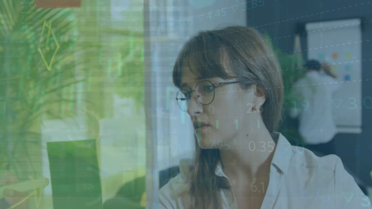 Animation of data processing over caucasian businesswoman in office