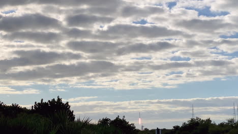 A-view-of-a-rocket-taking-off-and-flying-into-space-through-the-clouds