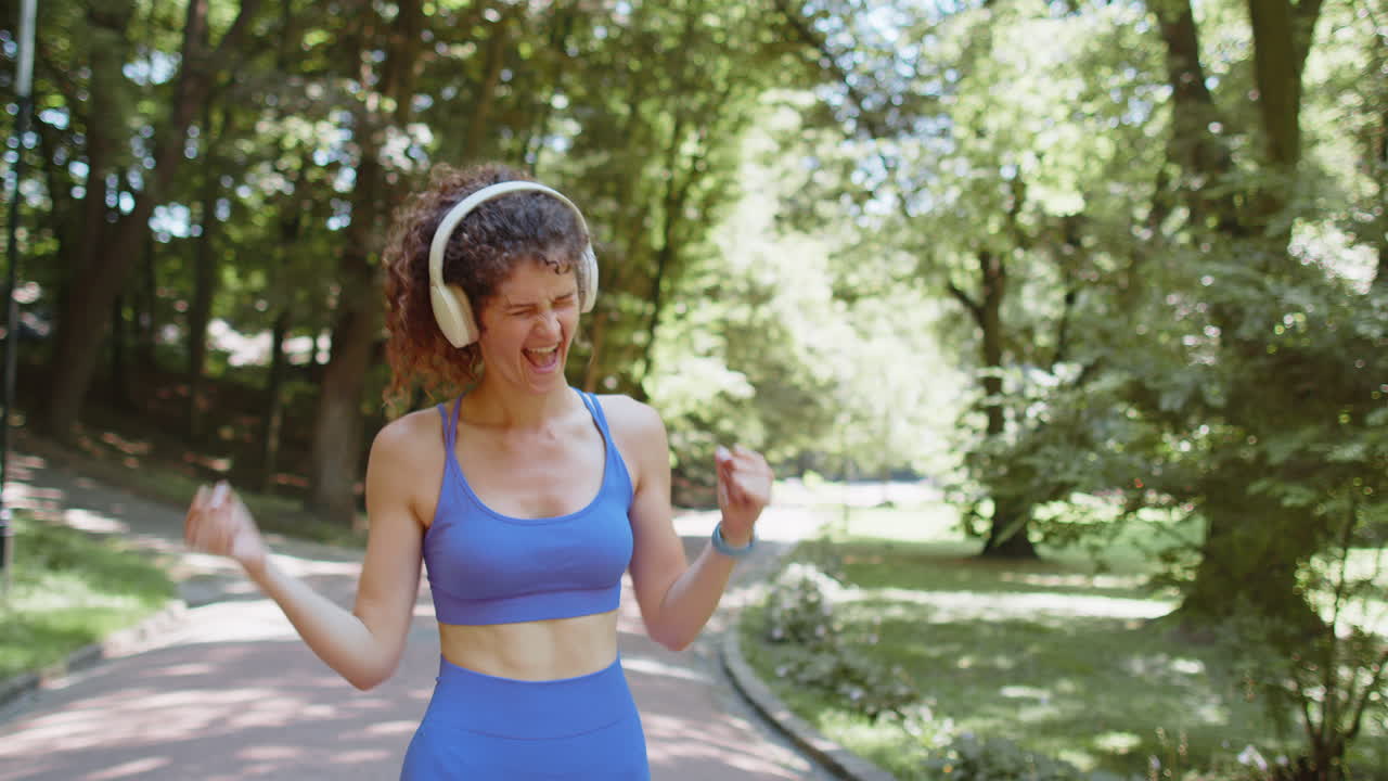 Athletic fitness sport runner woman finishing racing competition victory success workout cardio