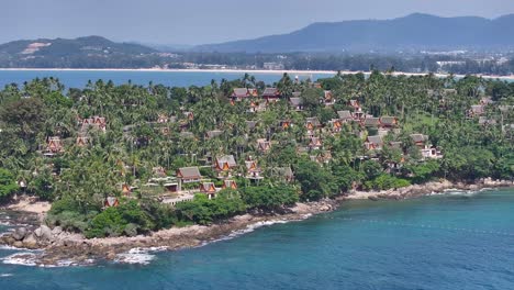 villas and temples on phuket coastal. drone view, development, tourism, accomodation.
