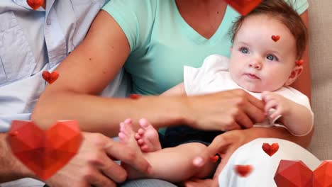 animation of falling hearts over happy caucasian family