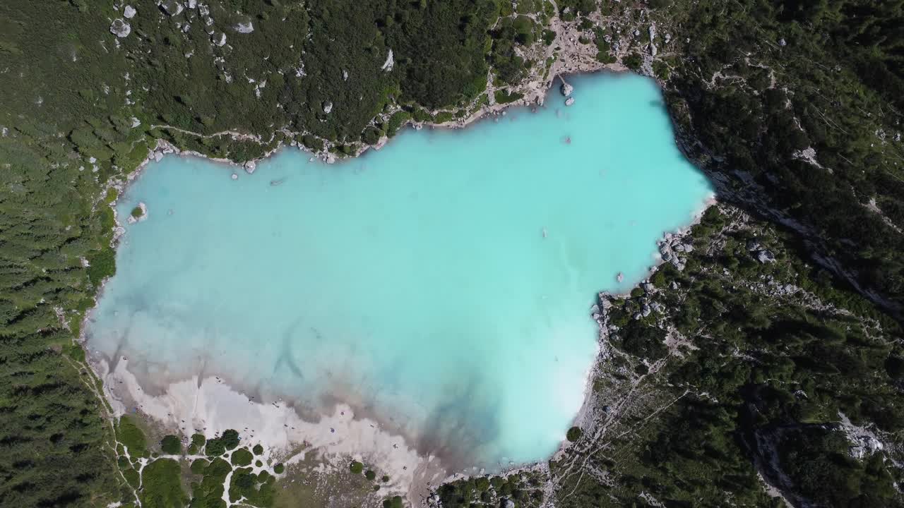 lake sorapis in the italian dolomites from above (by drone), stunning turquoise blue water colour