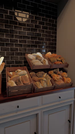 a display of fresh breads in a bakery