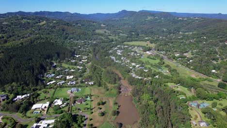 aerial view over currumbin valley residential area in gold coast, qld, australia - drone shot