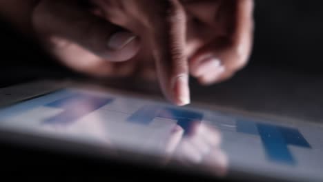 person using a tablet computer to interact with a graph or chart.