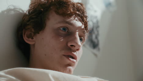 young male patient speaking to psychiatrist in mental hospital
