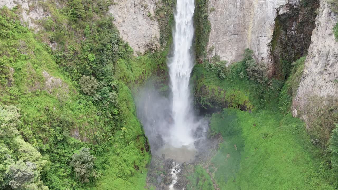 Drone view of Sipiso Piso waterfall amidst the lush Sumatran landscape