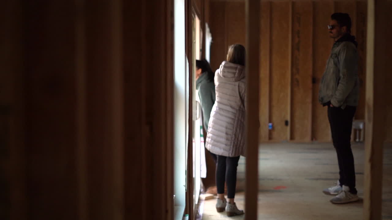 Young family is building a new home and complaining about the unfinished work outside