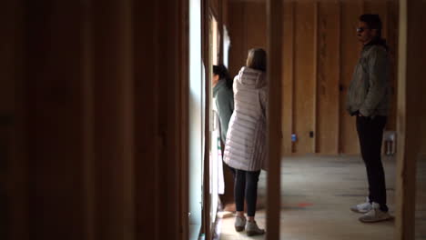 young family is building a new home and complaining about the unfinished work outside
