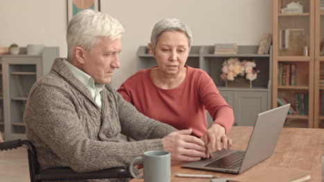 senior couple learning computer skills