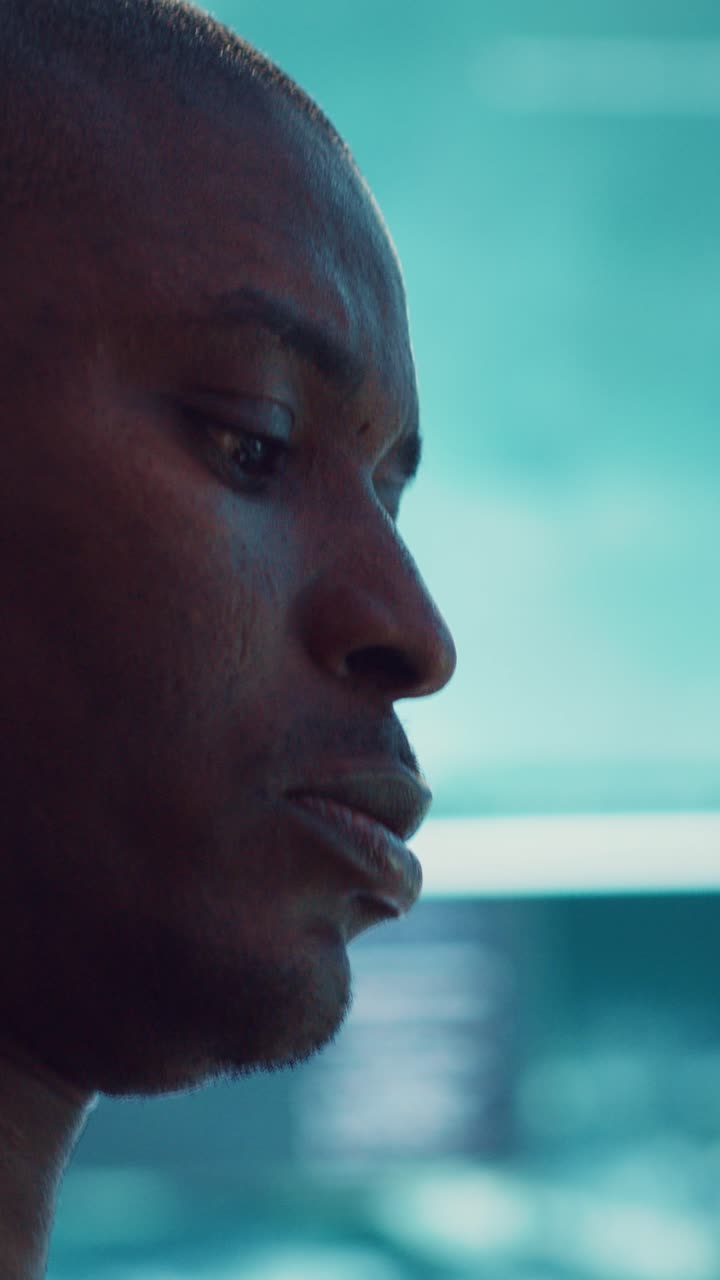 Close-up Profile of a Thoughtful Young Black Man Traveling
