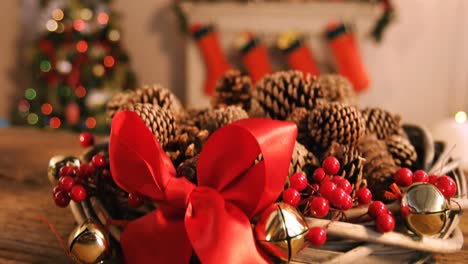 Grapevine-wreath-with-red-ribbon-and-pine-cone