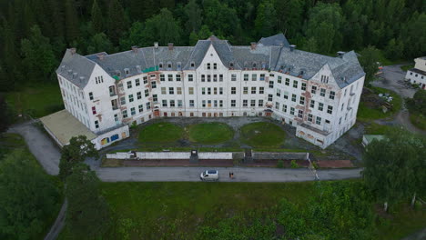 on hillside in norway, overlooking a beautiful fjord, luster sanatorium