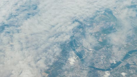 aerial shot of city and meandering river