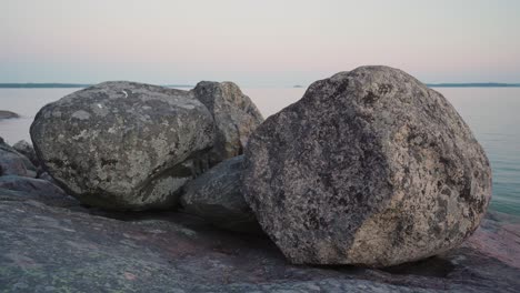 rocks on the shore right after the sunset