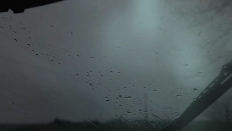 Windshield-wiper-running-on-a-stormy-afternoon