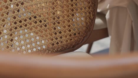 Front-view-of-chair-for-dining-table-in-restaurant-close-up-shot,tilt-right